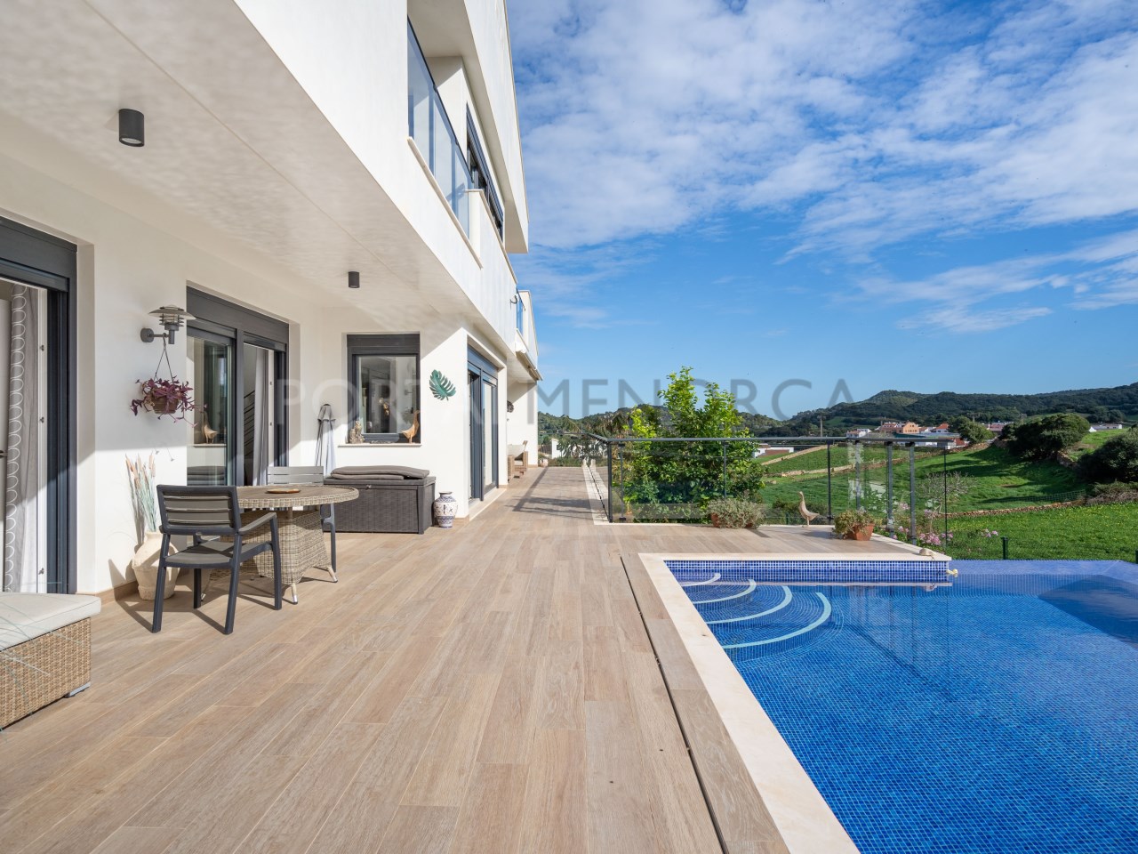 Terrace with pool and countryside views in luxury house in Mercadal