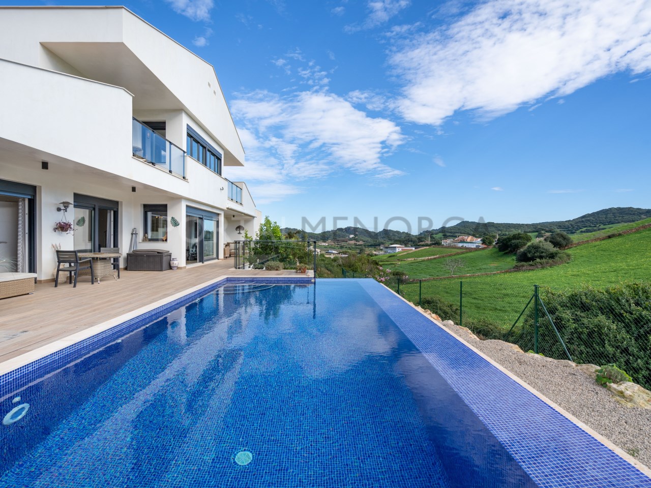 Pool with countryside view in luxury house in Mercadal