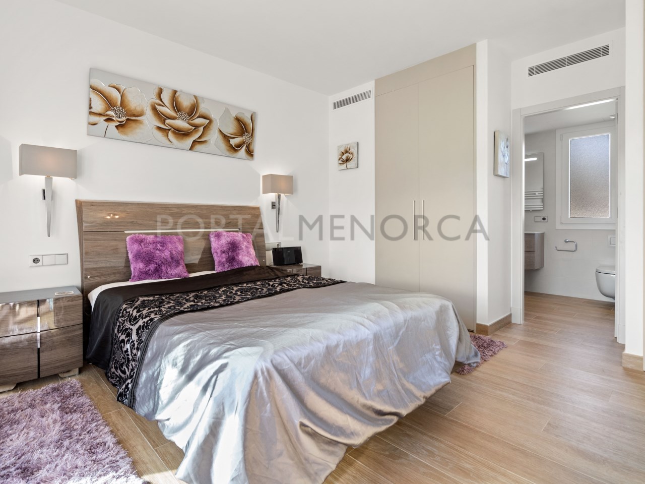 Double bedroom with terrace and bathroom in luxury house in Mercadal