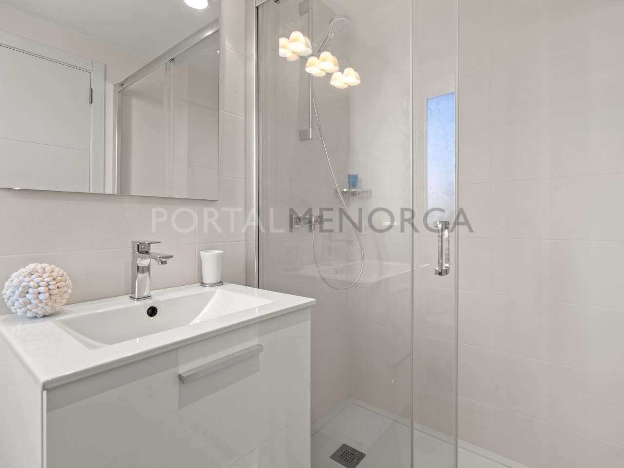 En-suite bathroom with shower in luxury house in Mercadal