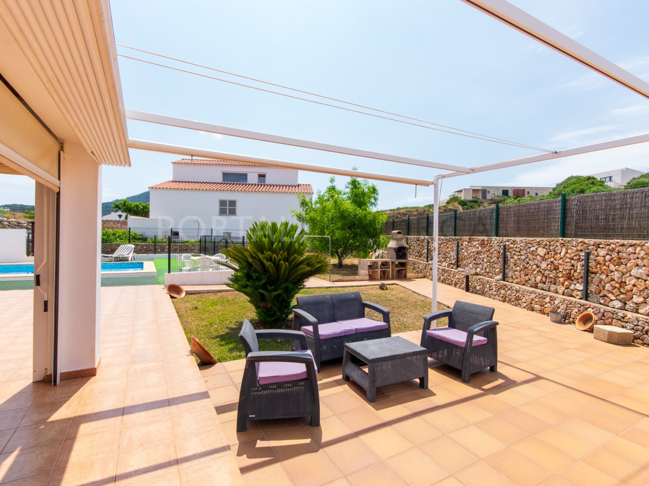 Terrace of a Menorcan house with pool and garage in Mercadal