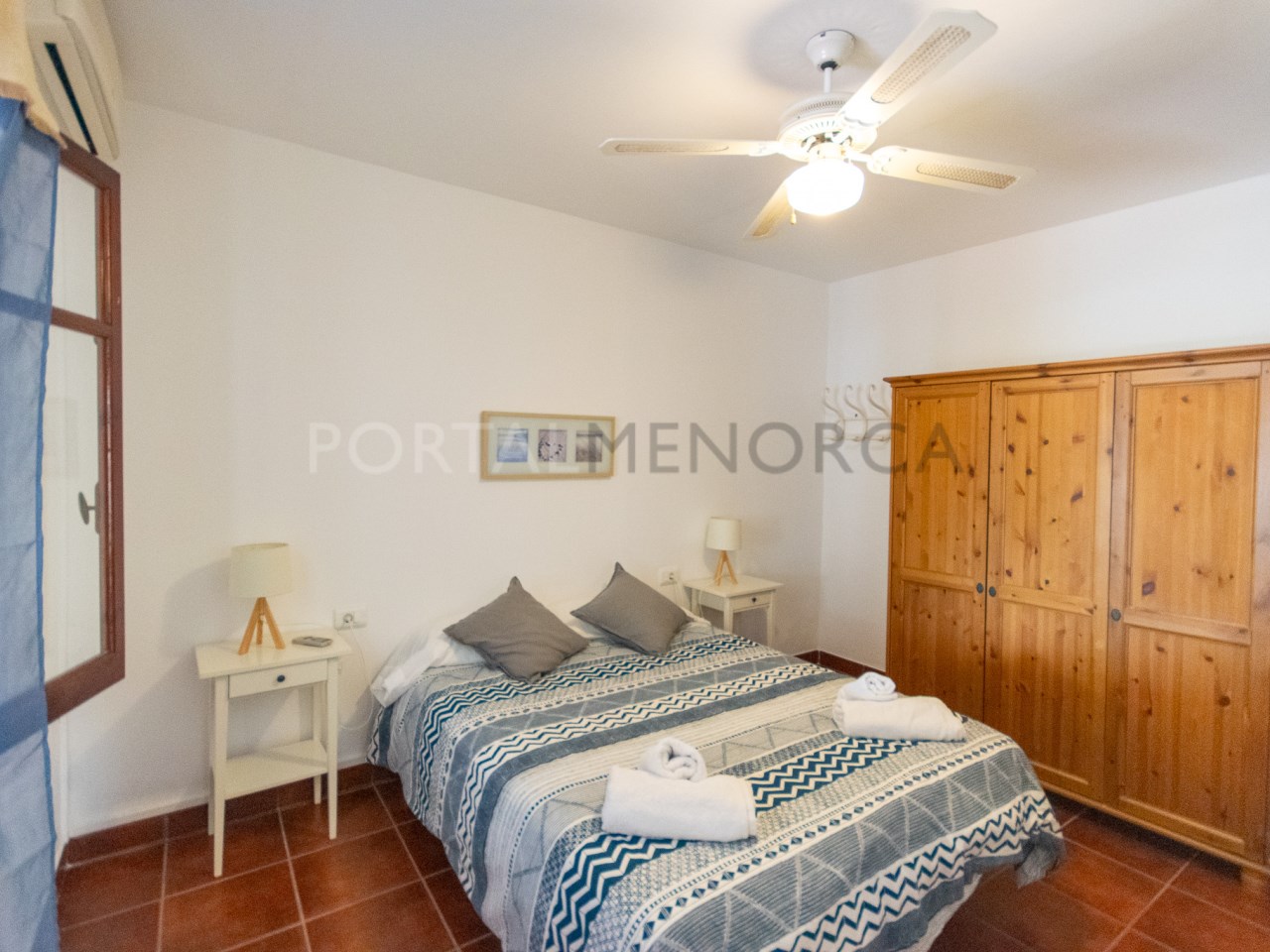 Bedroom of a villa with tourist license for sale in Cala n Bosch