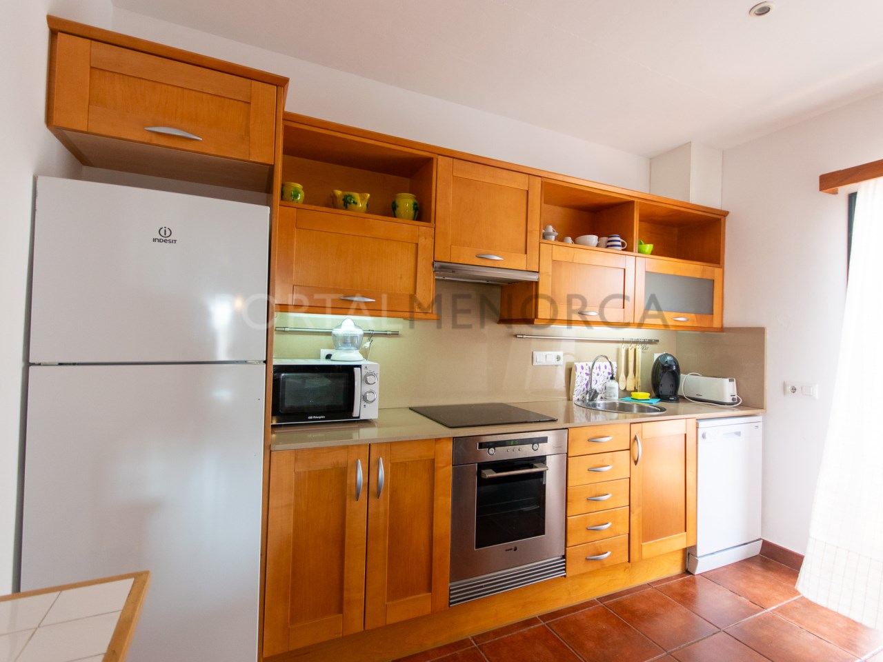 Kitchen of a villa with tourist license for sale in Cala n Bosch