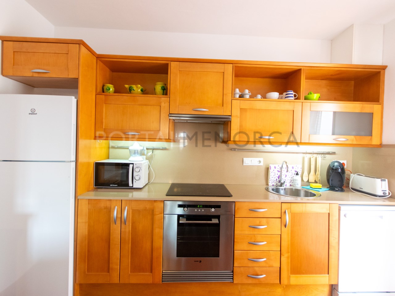 Kitchen of a villa with tourist license for sale in Cala n Bosch