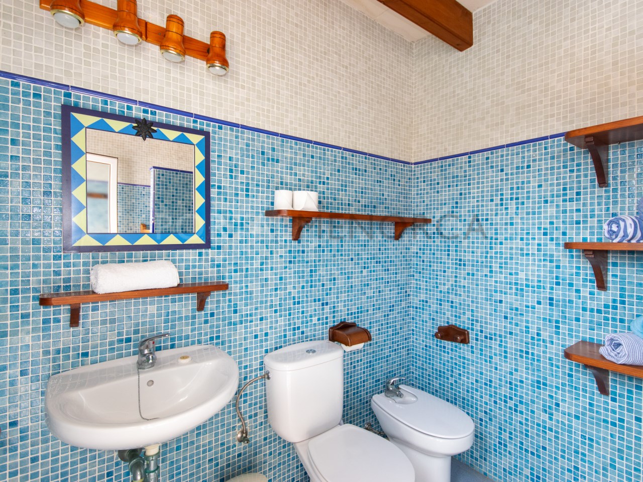 Bathroom with shower attached to a villa with tourist license for sale in Cala n Bosch