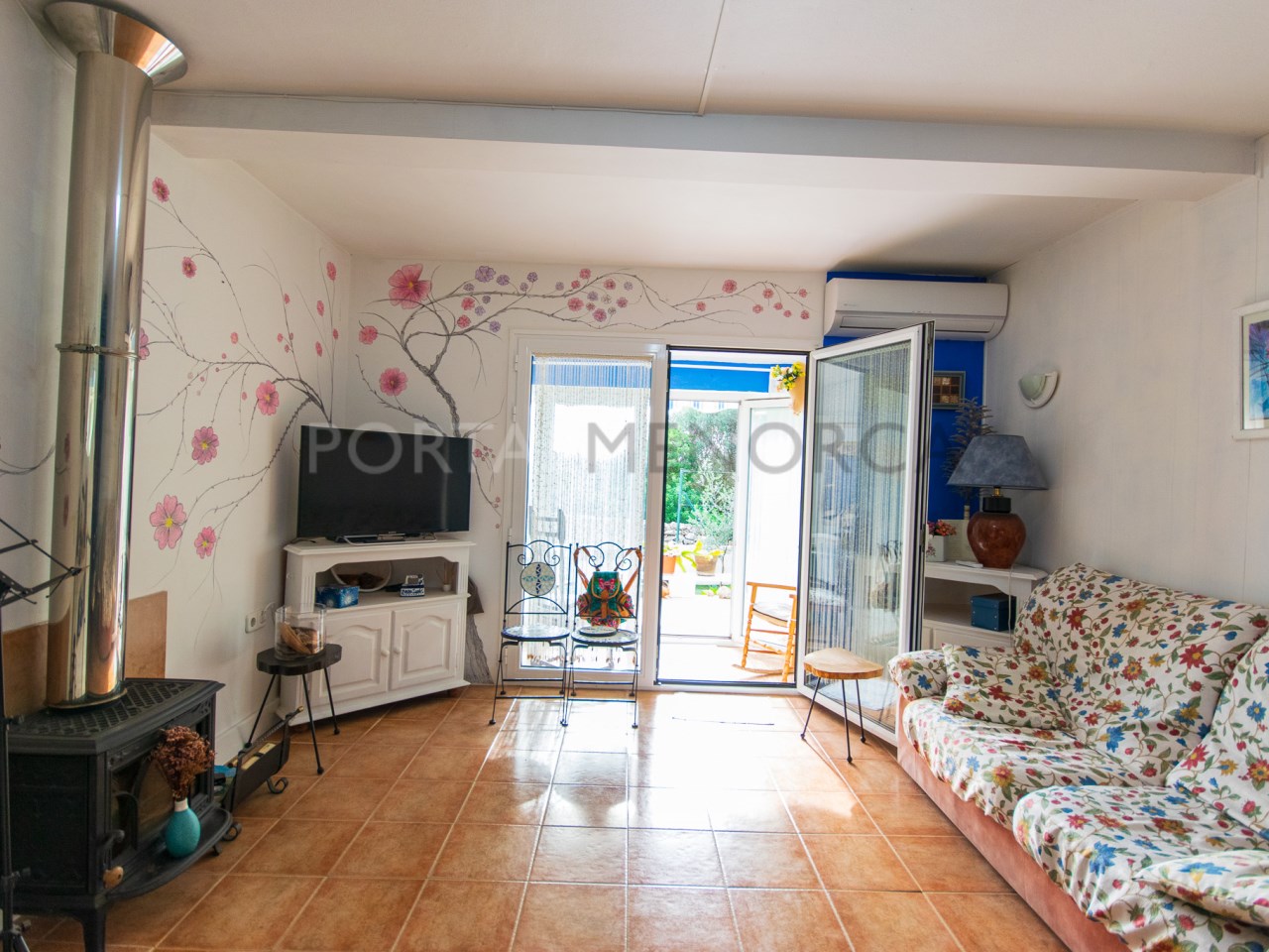 Living-dining room of two-bedroom townhouse for sale in Cales Coves