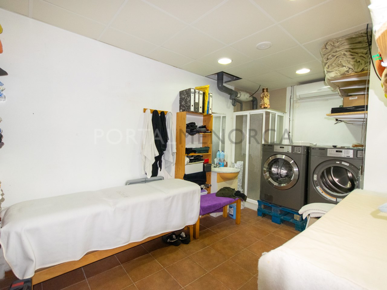 Laundry area in a building for sale in the village of Sant Lluis