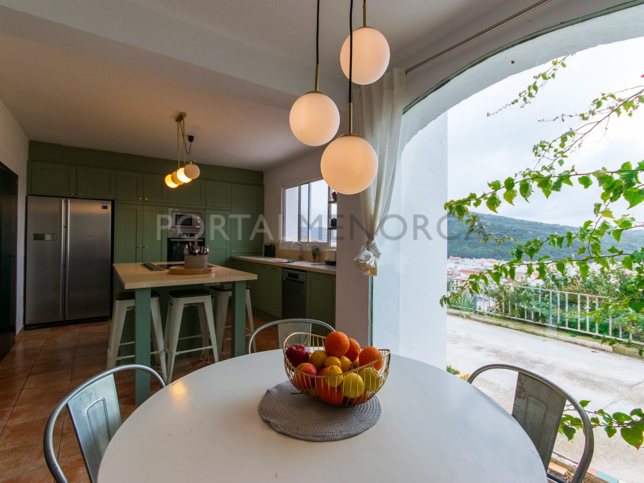 Kitchen-dining room of charming house with grounds and views of the village of Ferreries