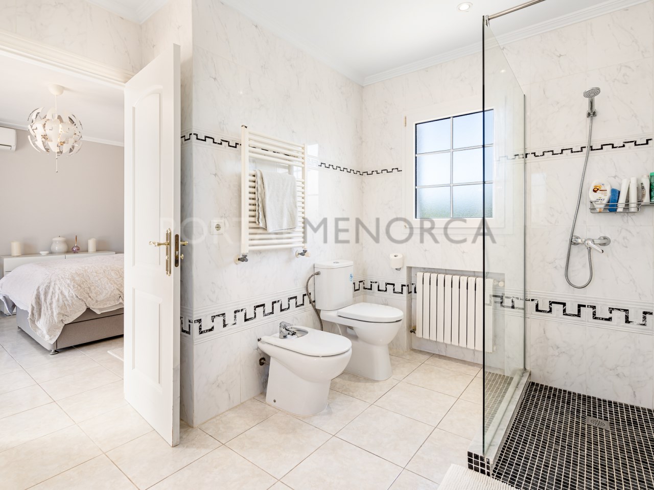 En-suite bathroom of detached villa with sea views in Addaia