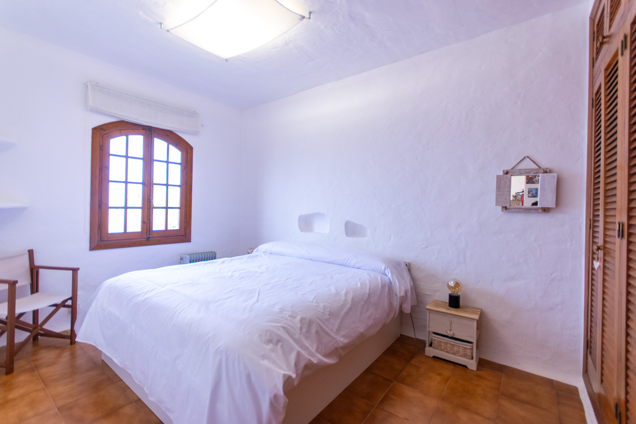 Double bedroom of frontline apartment in Playas de Fornells.