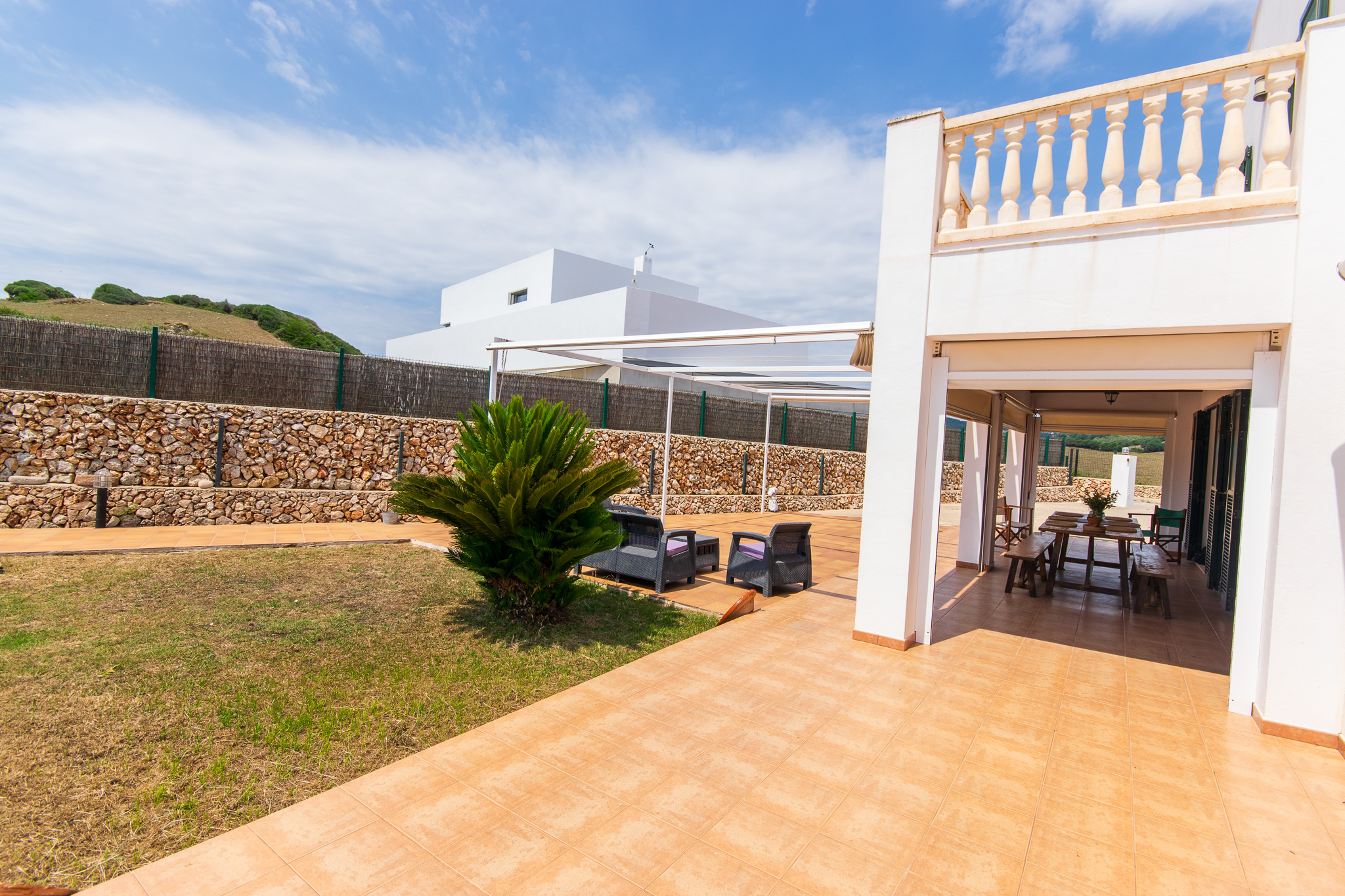 Terrace of a Menorcan house with pool and garage in Mercadal