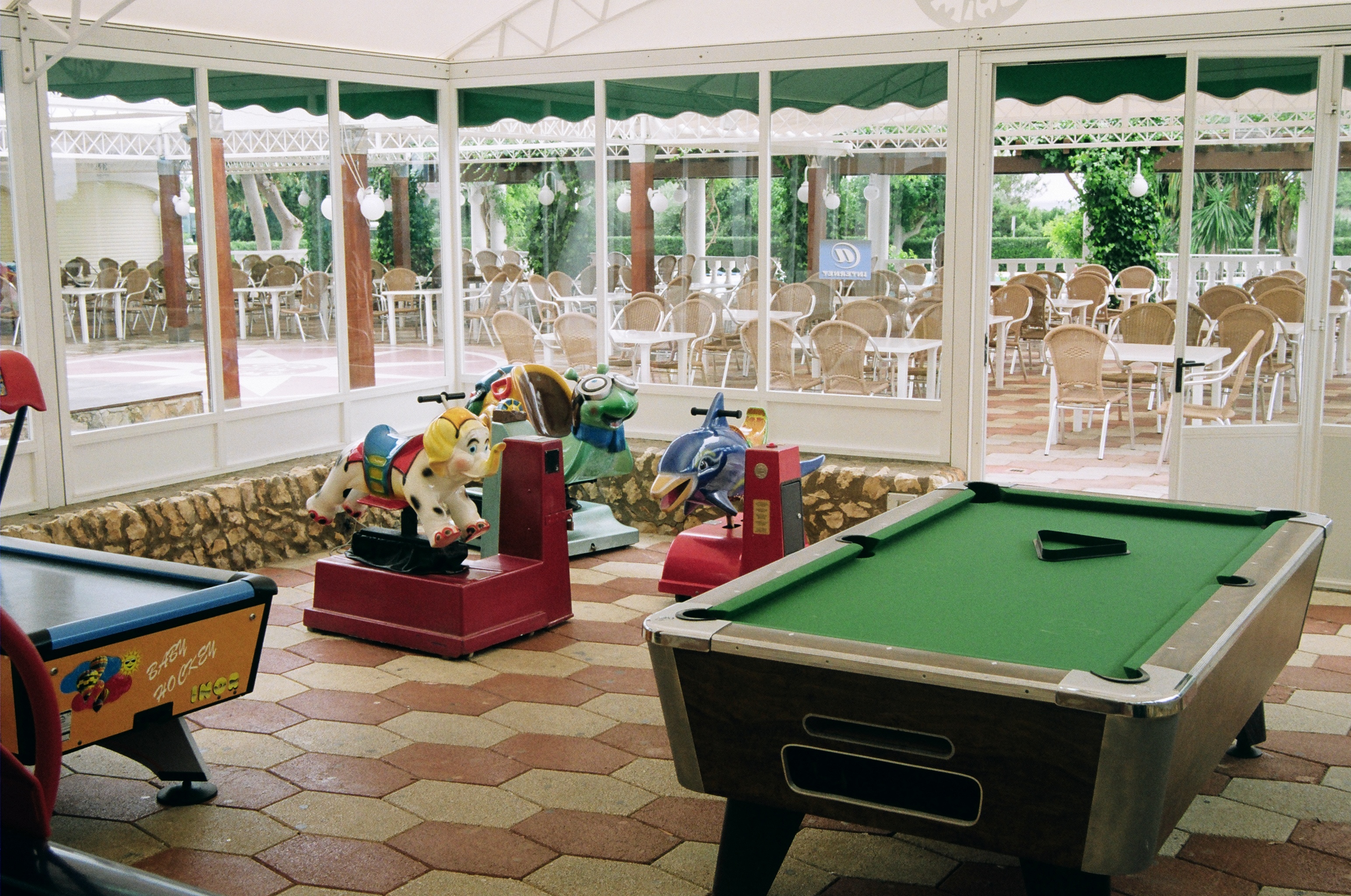 Bar-Restaurant games room with swimming pool and leisure area in Son Bou