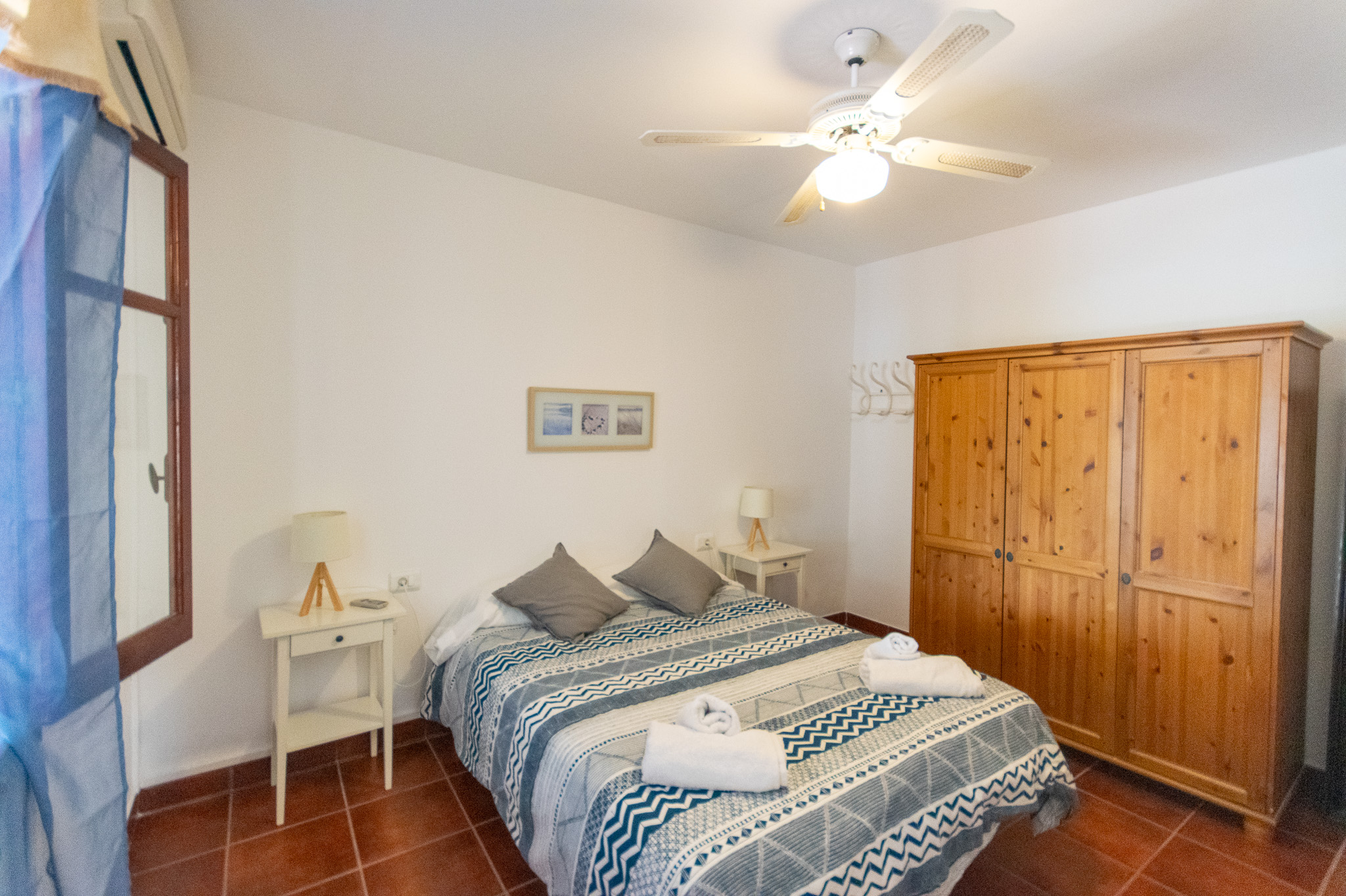 Bedroom of a villa with tourist license for sale in Cala n Bosch