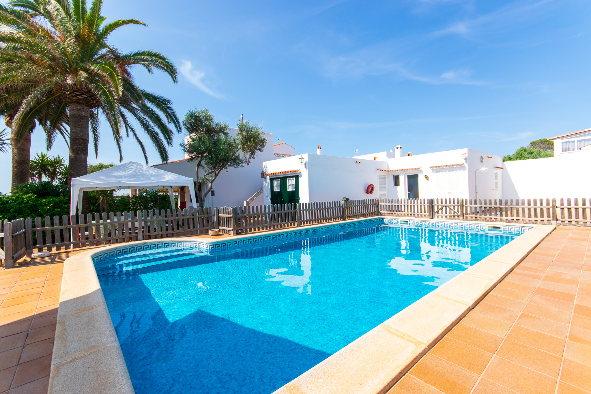 Swimming pool of a villa with tourist license for sale in Cala n Bosch