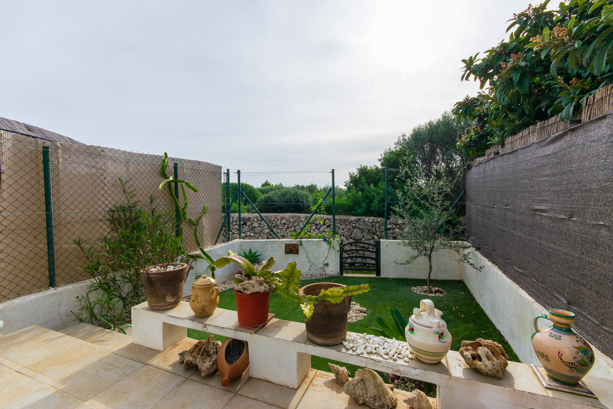 Terrace of two-bedroom townhouse for sale in Cales Coves