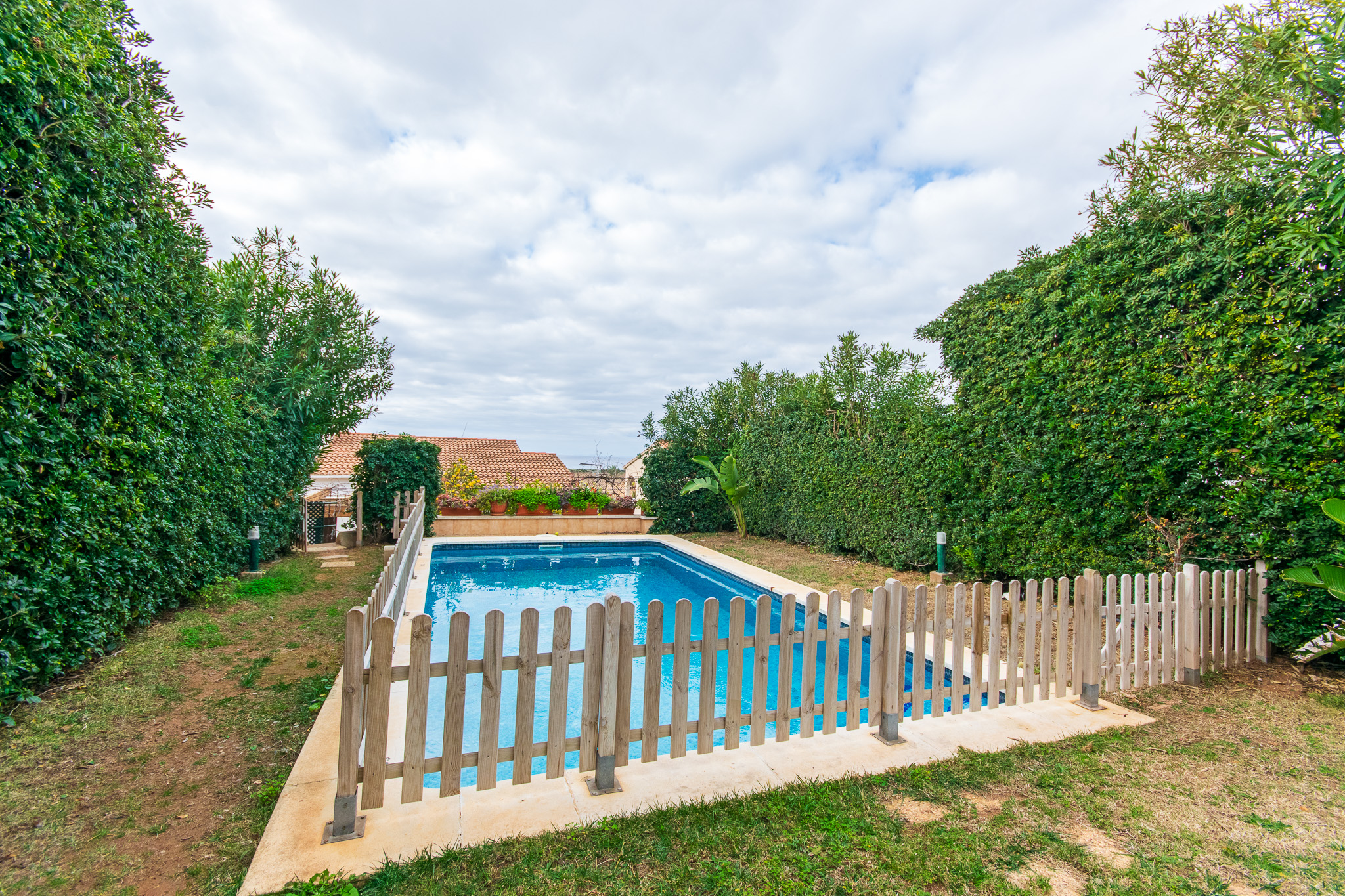 Pool and garden of beautiful villa with pool and sea views in Torre Solí
